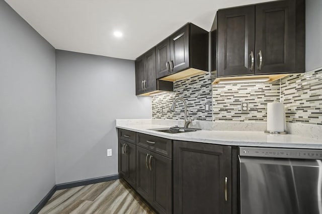 69 Greenwood St, Boston, MA 02122 - kitchen featuring stainless steel dishwasher, a sink, light wood finished floors, and backsplash