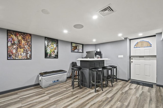 69 Greenwood St, Boston, MA 02122 - indoor dry bar featuring wood finished floors, baseboards, freestanding refrigerator, and recessed lighting
