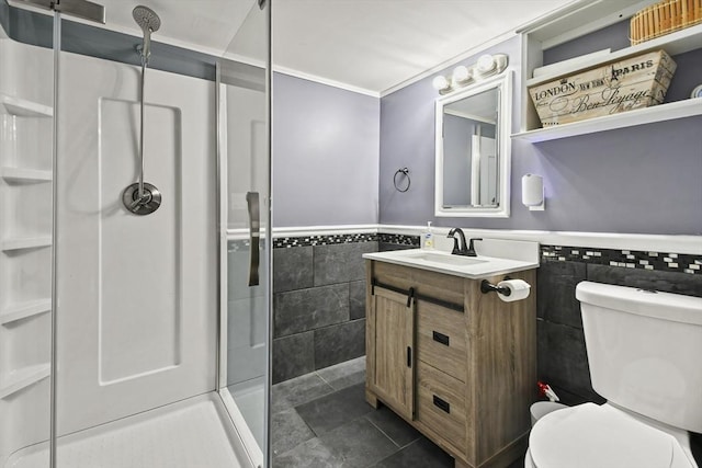 69 Greenwood St, Boston, MA 02122 - bathroom featuring tile walls, a stall shower, a wainscoted wall, toilet, and vanity