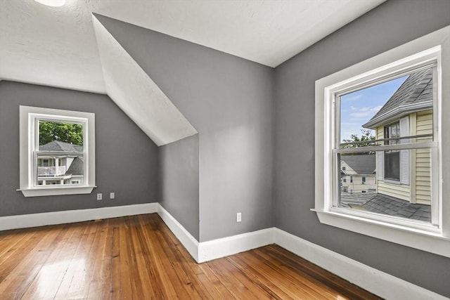 69 Greenwood St, Boston, MA 02122 - bonus room featuring baseboards, hardwood / wood-style floors, and lofted ceiling