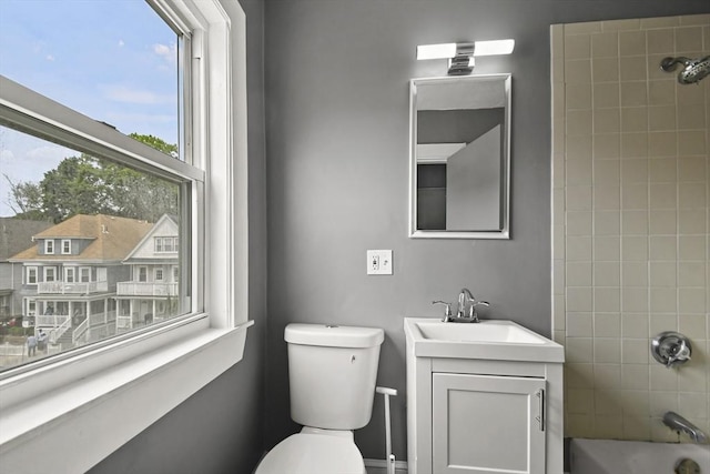 69 Greenwood St, Boston, MA 02122 - bathroom featuring vanity, toilet, and shower / tub combination