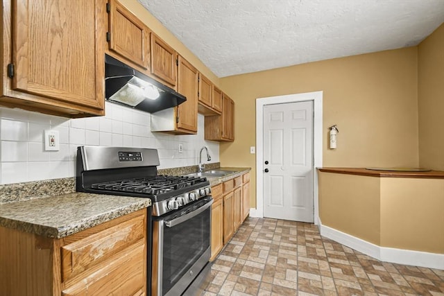 69 Greenwood St, Boston, MA 02122 - kitchen featuring stainless steel gas stove, ventilation hood, a sink, baseboards, and tasteful backsplash