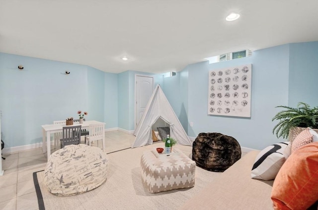 sitting room featuring tile patterned flooring, recessed lighting, and baseboards