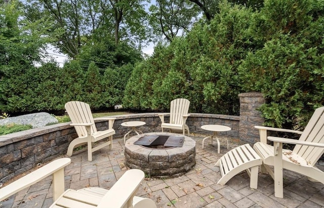 view of patio / terrace with an outdoor fire pit