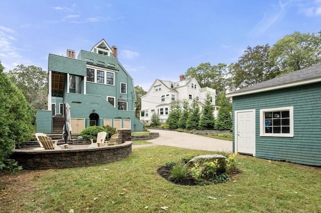 view of yard with stairs and a patio area