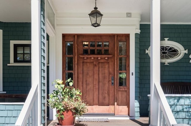 entrance to property featuring a porch