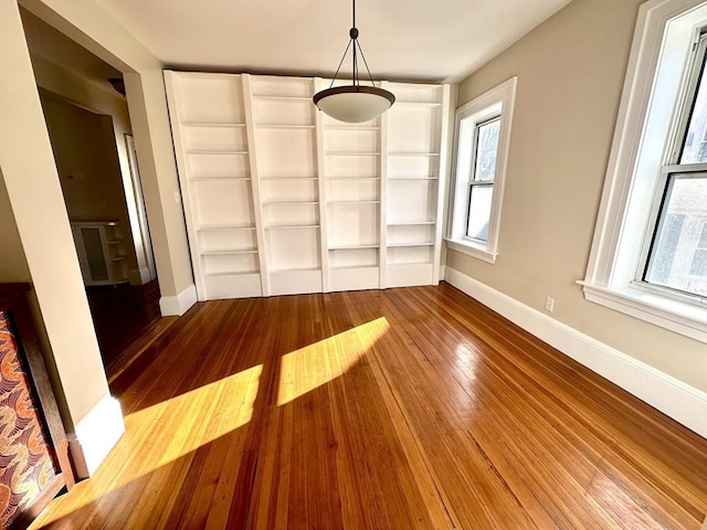 unfurnished dining area with hardwood / wood-style floors