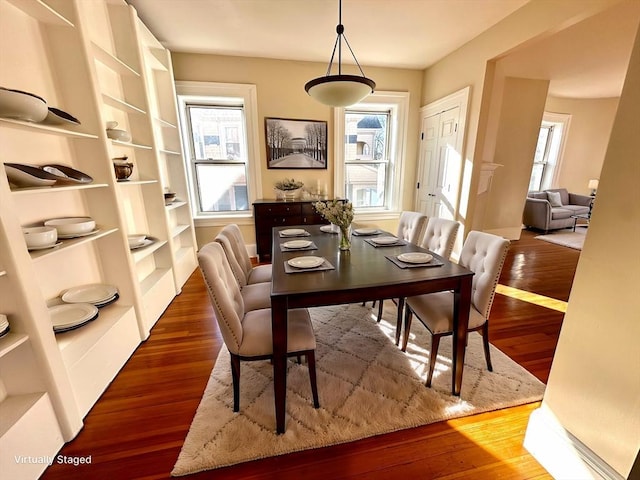 dining area featuring hardwood / wood-style floors and a wealth of natural light