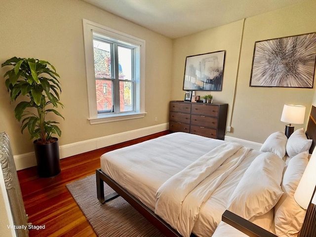 bedroom featuring dark hardwood / wood-style floors