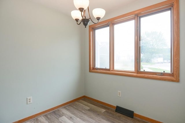 31 Blithewood Ave Unit 106, Worcester, MA 01604 - empty room featuring a chandelier and light wood-type flooring