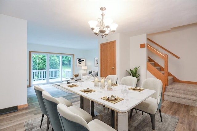 31 Blithewood Ave Unit 106, Worcester, MA 01604 - dining area featuring a chandelier, stairs, and light wood-style flooring