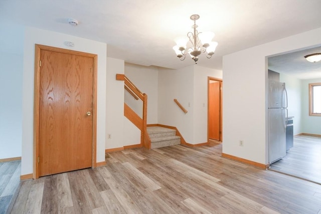 31 Blithewood Ave Unit 106, Worcester, MA 01604 - foyer entrance featuring light wood-type flooring, a chandelier, and stairway