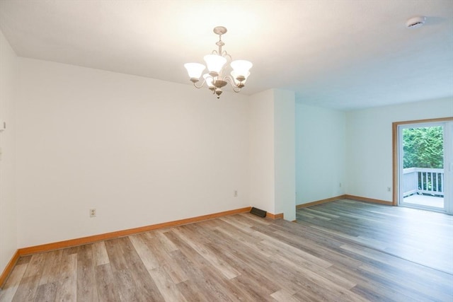 31 Blithewood Ave Unit 106, Worcester, MA 01604 - empty room with a chandelier, light wood-style flooring, and a smoke detector