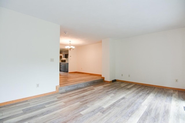 31 Blithewood Ave Unit 106, Worcester, MA 01604 - unfurnished room featuring a chandelier and light wood-type flooring