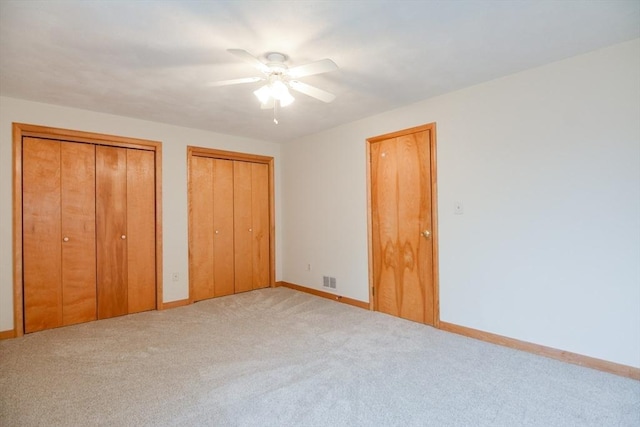 31 Blithewood Ave Unit 106, Worcester, MA 01604 - unfurnished bedroom featuring carpet flooring, multiple closets, and ceiling fan