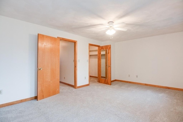 31 Blithewood Ave Unit 106, Worcester, MA 01604 - unfurnished bedroom featuring light carpet, a spacious closet, ceiling fan, and a closet
