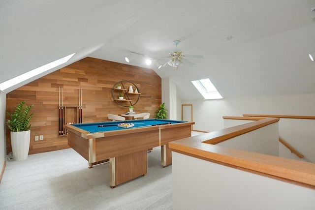 31 Blithewood Ave Unit 106, Worcester, MA 01604 - playroom featuring a skylight, vaulted ceiling, wood walls, a ceiling fan, and light colored carpet