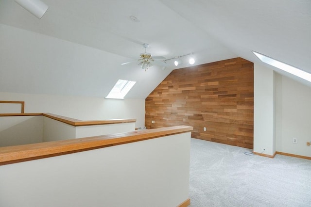 31 Blithewood Ave Unit 106, Worcester, MA 01604 - bonus room with a skylight, wood walls, lofted ceiling, ceiling fan, and carpet flooring