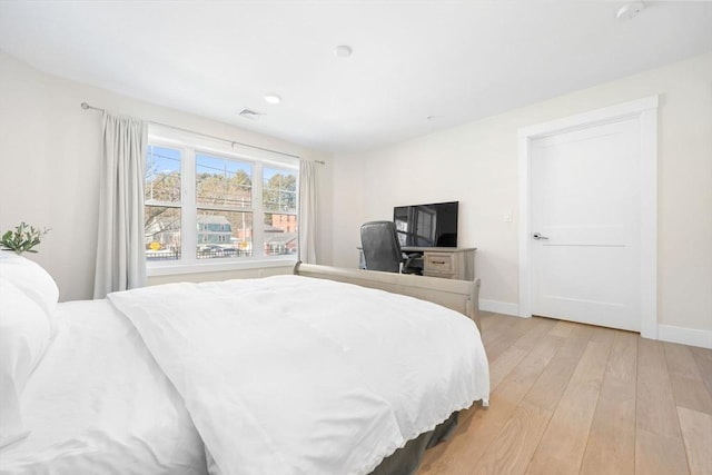 bedroom with light hardwood / wood-style floors