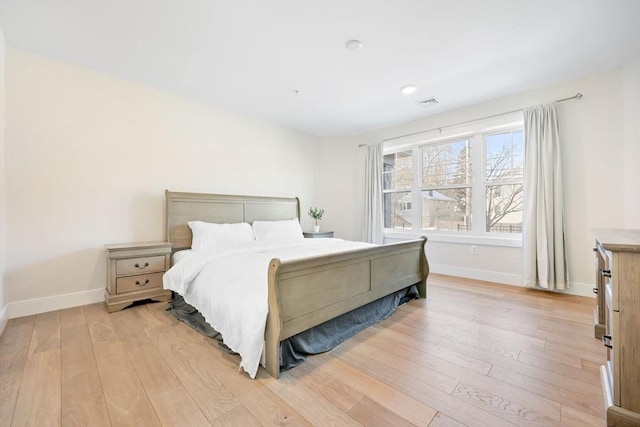 bedroom with light hardwood / wood-style flooring