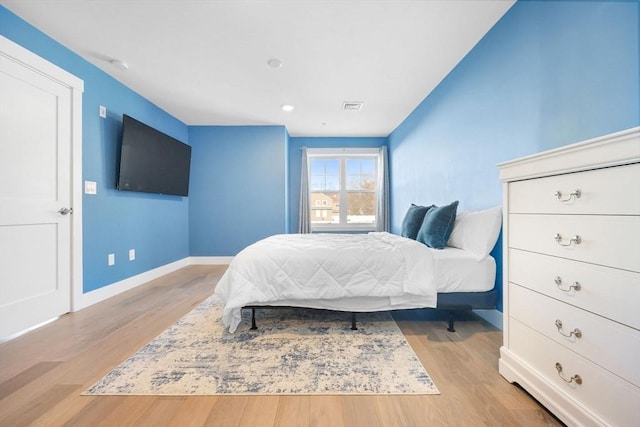 bedroom with light hardwood / wood-style floors