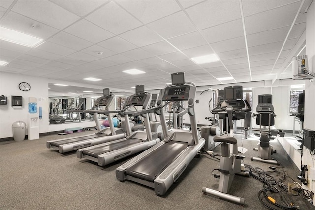 exercise room featuring a paneled ceiling