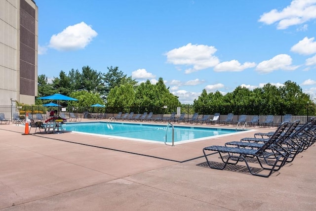 view of swimming pool with a patio area