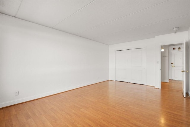 interior space featuring a closet and light hardwood / wood-style flooring