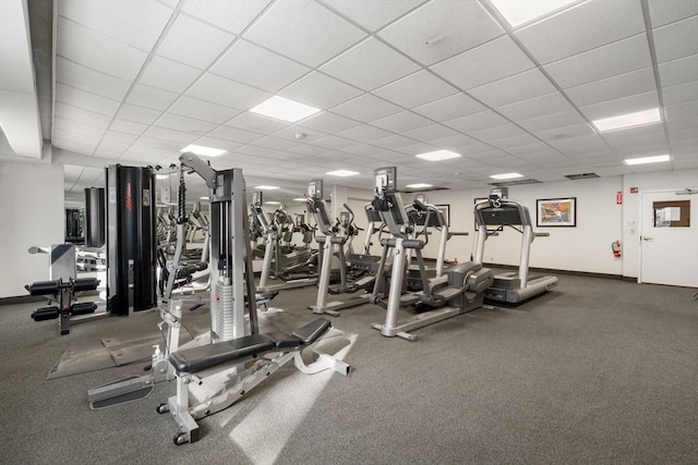 workout area featuring a paneled ceiling