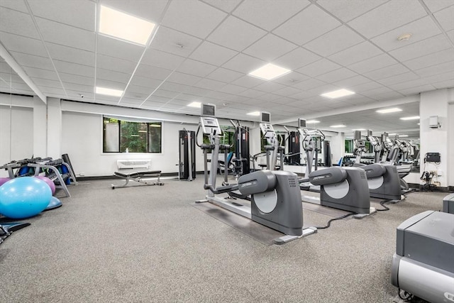 workout area featuring a paneled ceiling