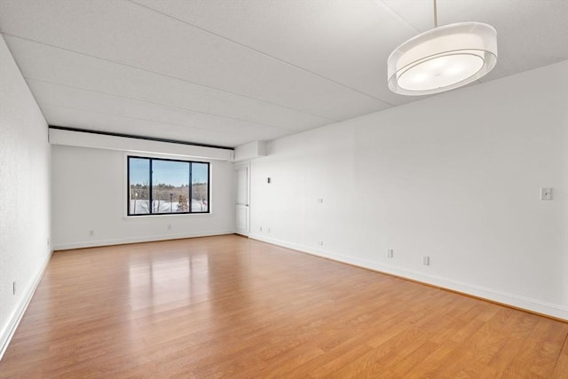 empty room featuring hardwood / wood-style floors