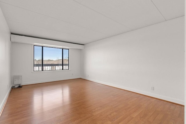 unfurnished room featuring hardwood / wood-style floors