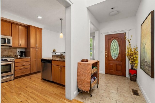 foyer featuring light hardwood / wood-style flooring and sink