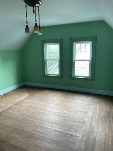 6 Newton Ave, Worcester, MA 01602 - additional living space with vaulted ceiling, wood-type flooring, baseboards, and healthy amount of natural light