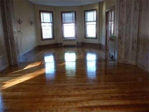 6 Newton Ave, Worcester, MA 01602 - empty room with baseboards and wood finished floors