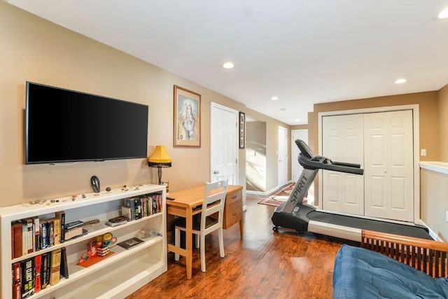 exercise area with dark hardwood / wood-style floors