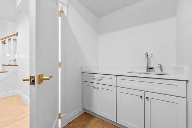 bathroom featuring hardwood / wood-style flooring and vanity