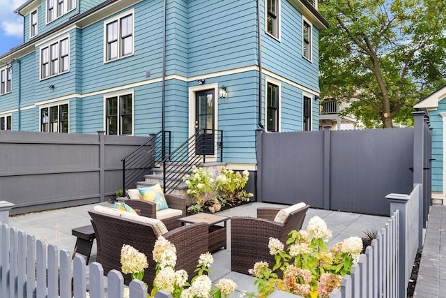 view of home's exterior featuring an outdoor living space and a patio