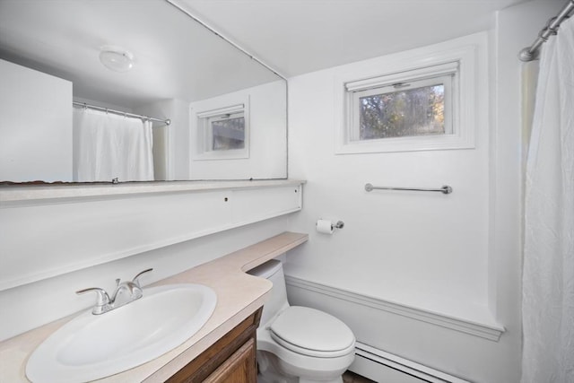 bathroom featuring walk in shower, vanity, a baseboard radiator, and toilet