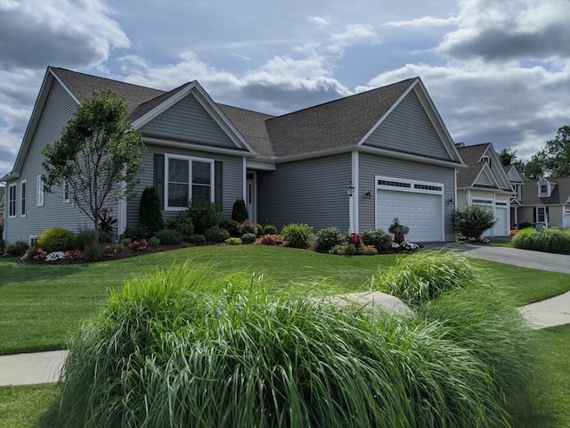 view of front of house with a garage and a front lawn