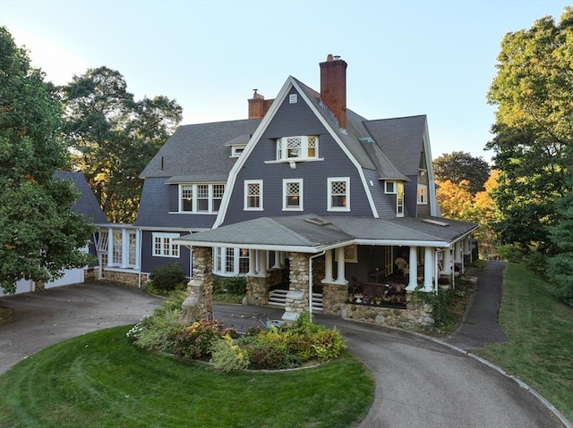 53 Abbott Rd, Wellesley, MA 02481 - shingle-style home featuring driveway, covered porch, a chimney, and a front lawn
