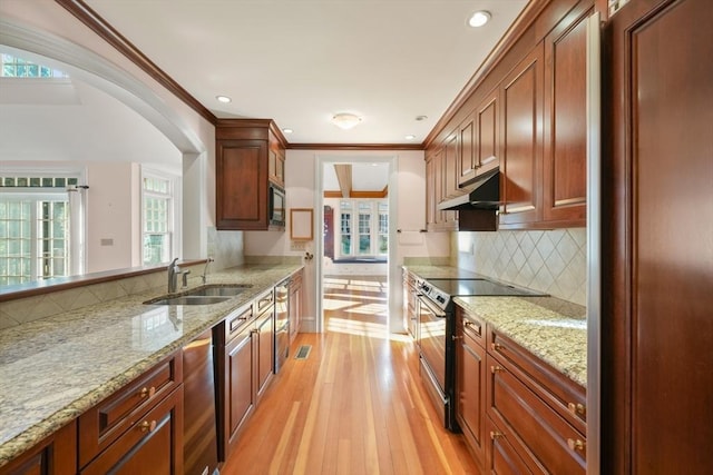 53 Abbott Rd, Wellesley, MA 02481 - kitchen with a sink, stainless steel electric stove, built in microwave, under cabinet range hood, and light wood-style floors