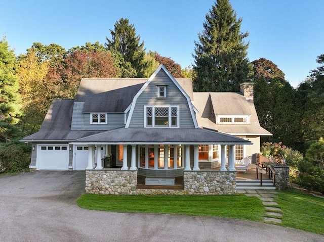 53 Abbott Rd, Wellesley, MA 02481 - shingle-style home featuring a porch, driveway, a garage, and a front lawn