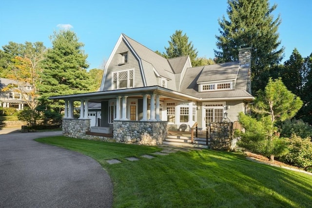 53 Abbott Rd, Wellesley, MA 02481 - shingle-style home with a front lawn, a porch, stone siding, and a chimney