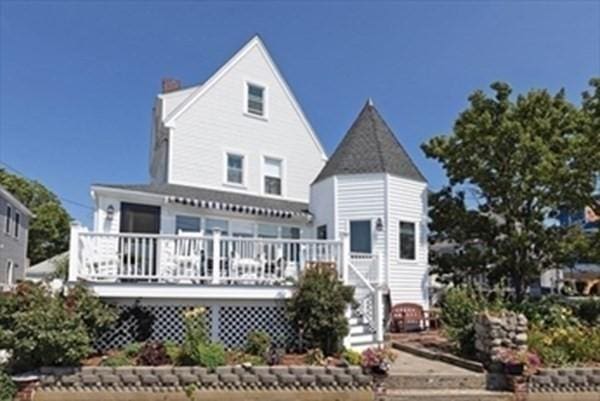 rear view of property featuring a deck