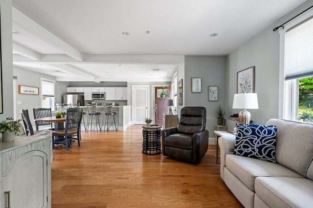 599 Washington St Unit 1, Pembroke, MA 02359 - living area with light wood-style flooring, beamed ceiling, and recessed lighting