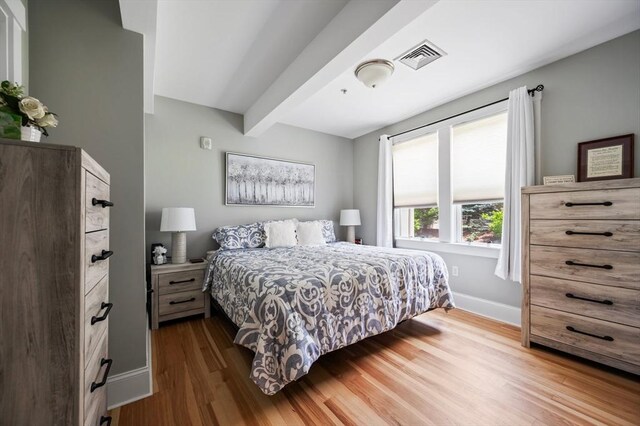 599 Washington St Unit 1, Pembroke, MA 02359 - bedroom featuring dark wood finished floors and beamed ceiling