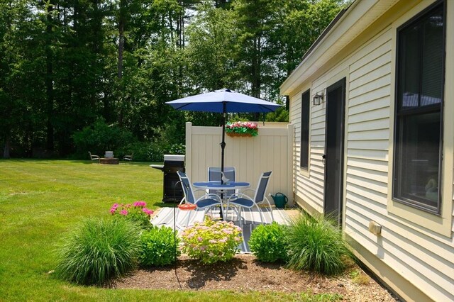 599 Washington St Unit 1, Pembroke, MA 02359 - view of grassy yard with a deck and view of scattered trees