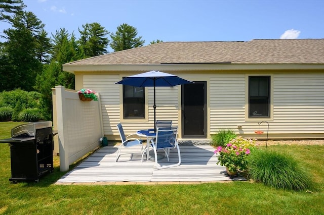 599 Washington St Unit 1, Pembroke, MA 02359 - rear view of house with a wooden deck, a shingled roof, and a yard