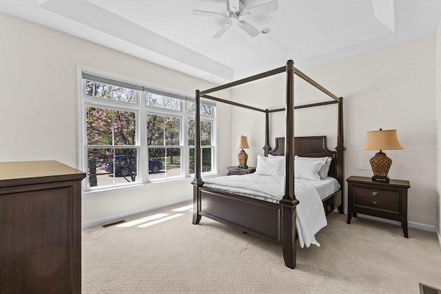 bedroom featuring light colored carpet, baseboards, and visible vents